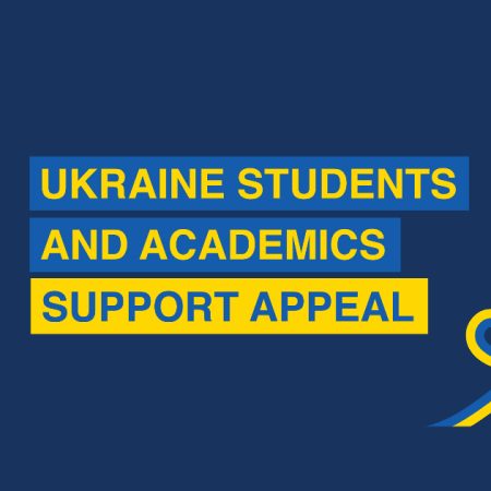 Ukraine Students and Academics Support Appeal. White University logo in a corporate blue background and a heart made with the Ukrainian flag coloursl